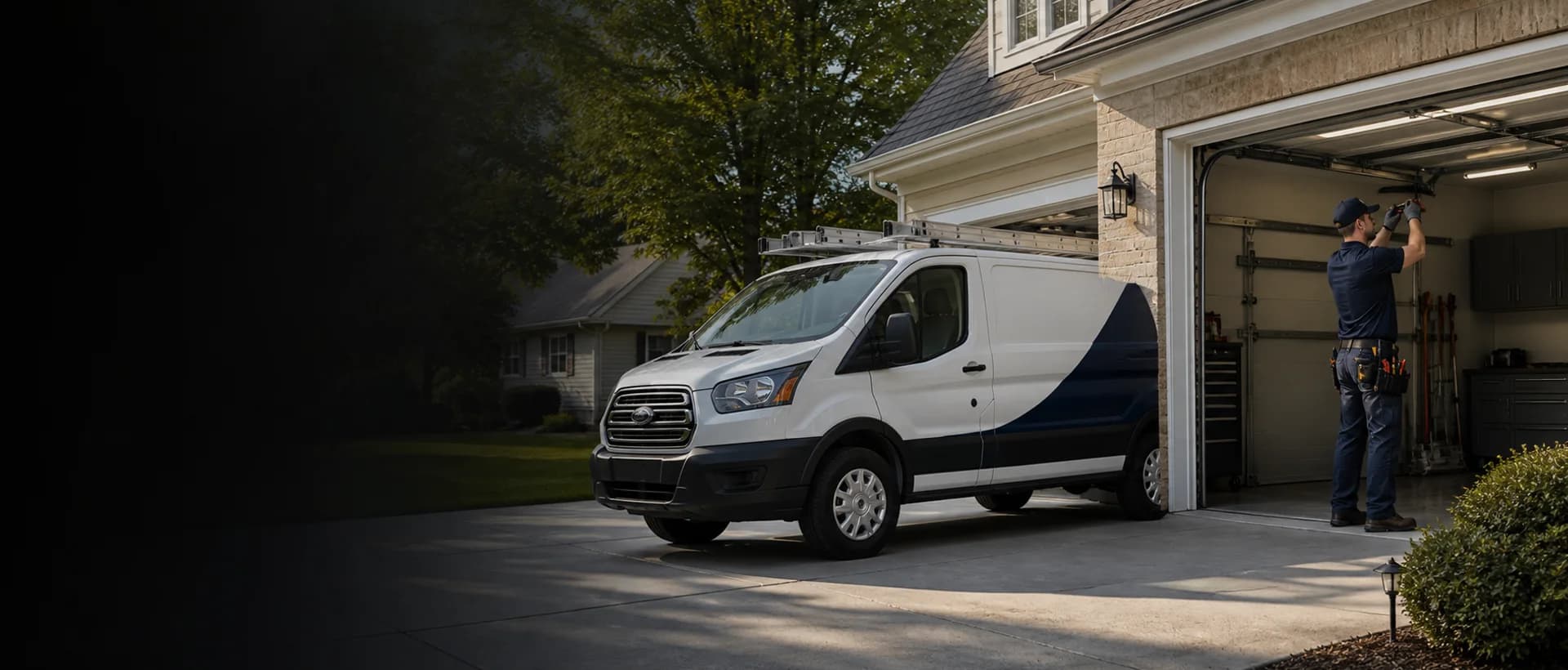 Garage door service technician working beside a service vehicle